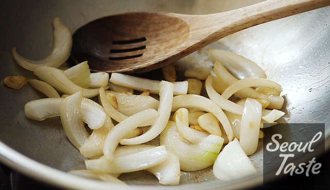 Stir-fry garlic and onions