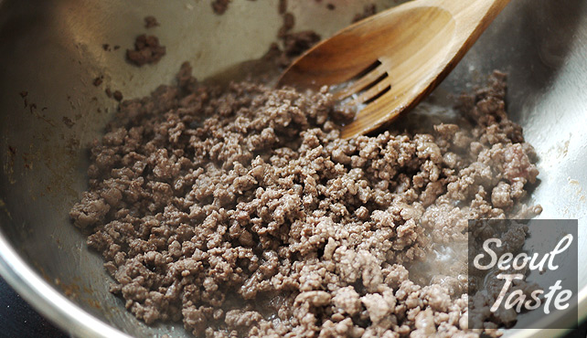 Brown ground beef and drain fat